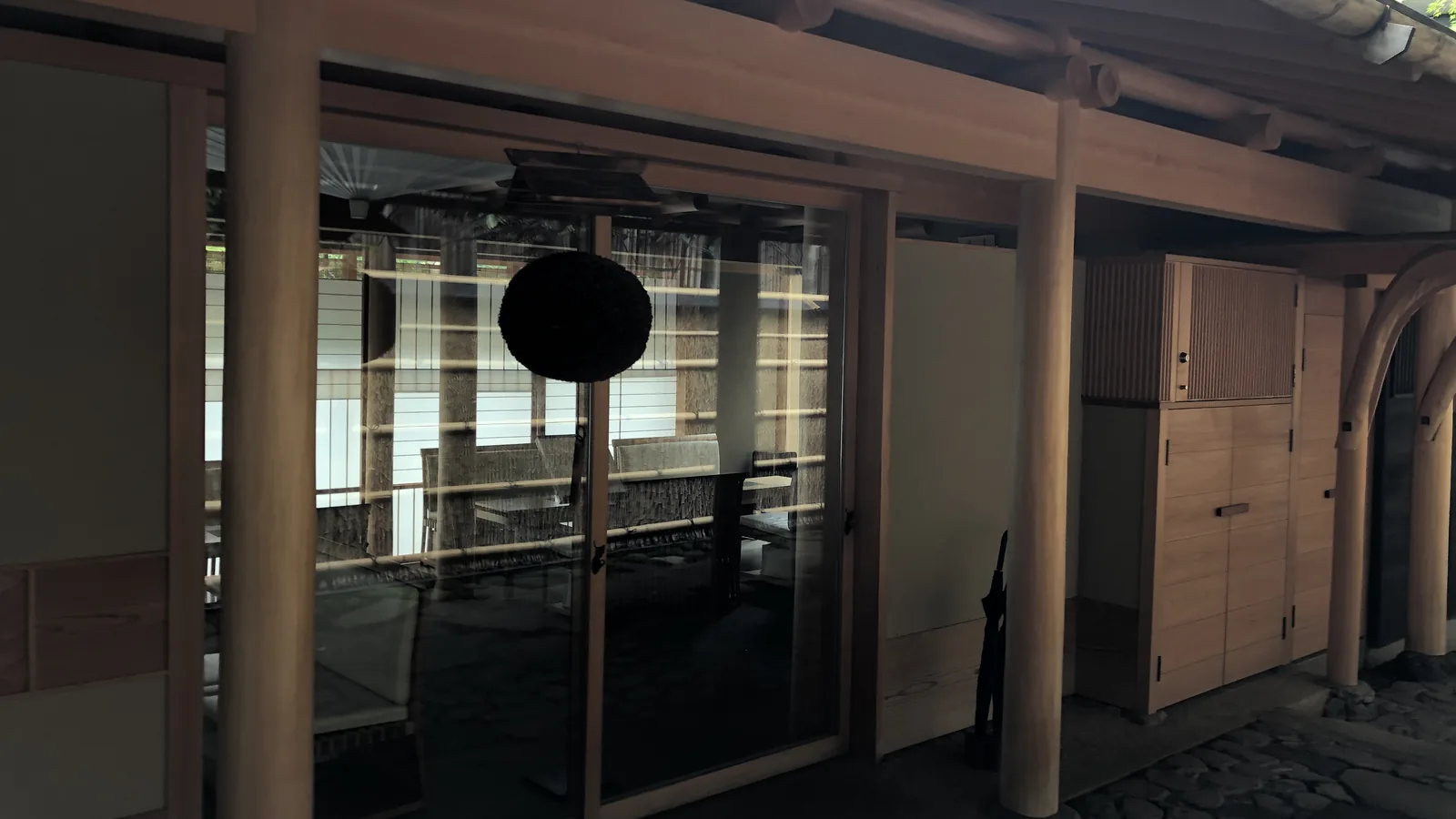 Glass doors opening onto a garden walkway